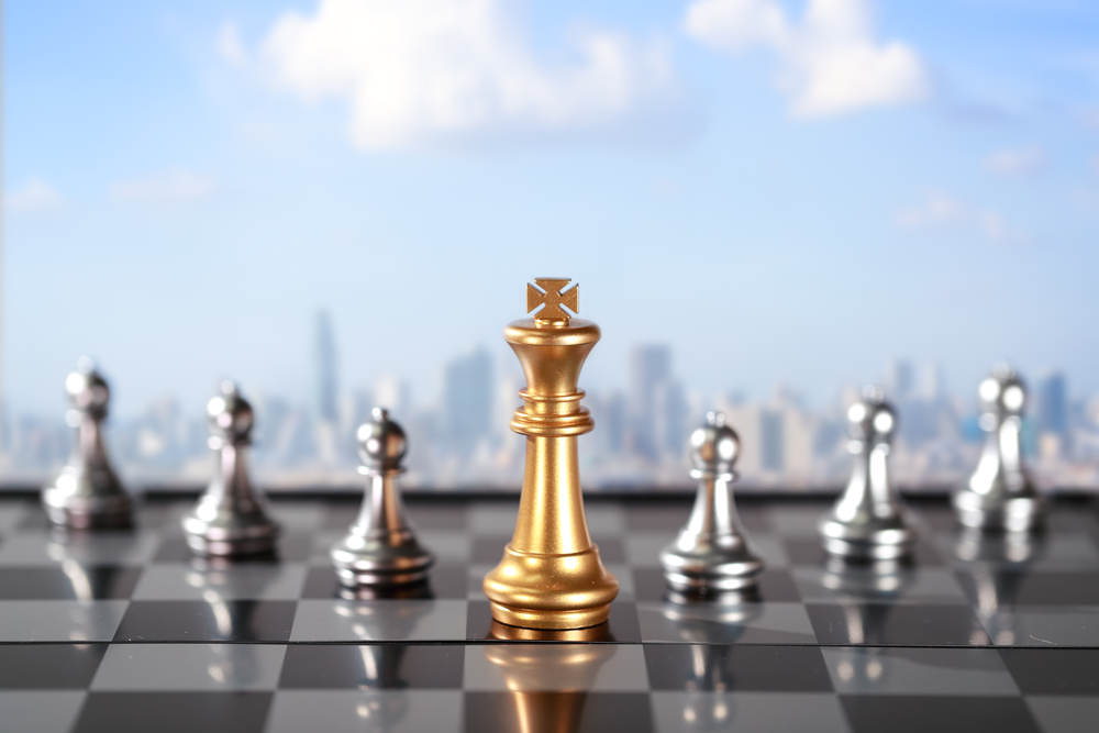 Chess board with chess pieces including the king and six pawns