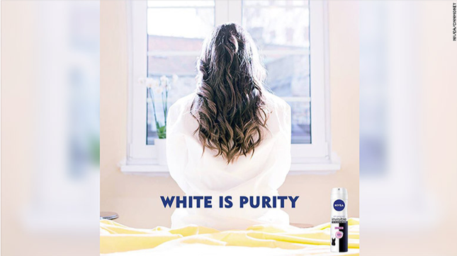 Nivea ad showing the back of a white woman with the caption White Is Purity.
