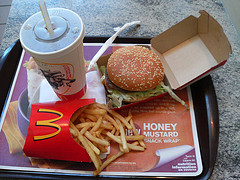 McDonald's hamburg, french fries and a cup of drink on a tray