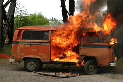 VW bus on fire from exploding car bomb