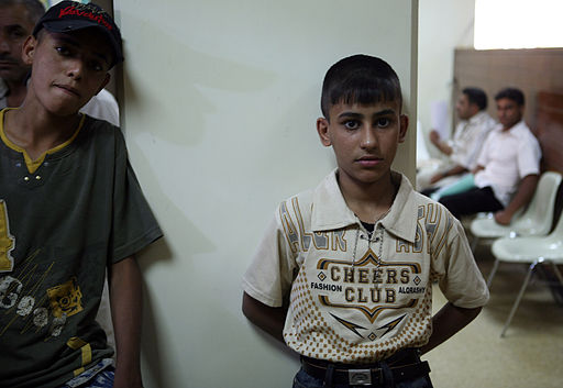 adolescents standing in waiting room